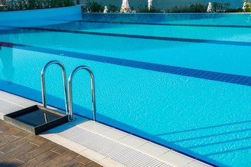 Nice swimming pool outdoors on bright summer day