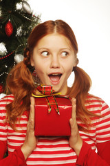 woman with gift box and christmas tree