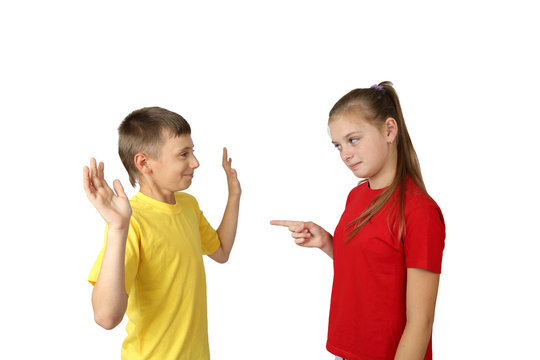 Accusation and acquittal gesture - teenage boy and girl in yellow and red t-shirts stand in full height isolated on white background