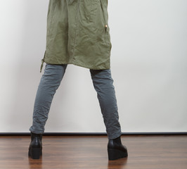 Closeup woman in dark green jacket. Autumn fashion