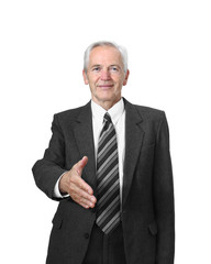 Senior man with friendly face gives his hand for handshake isolated on white background