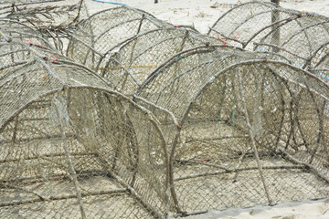 Crab traps stacked near bay in Thailand