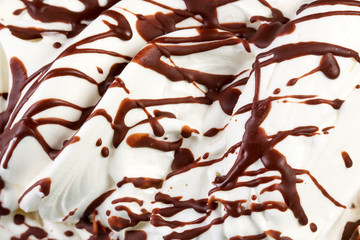 Mass of ice-cream with chocolate syrup.