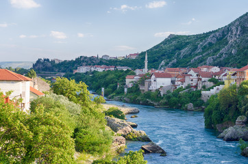 Fototapeta na wymiar View at the Mostar Old Town with beautiful river