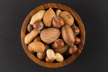 Mixed nuts in shells in a bowl