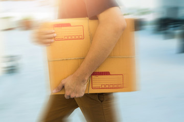 Delivery service holding to sent a package box.