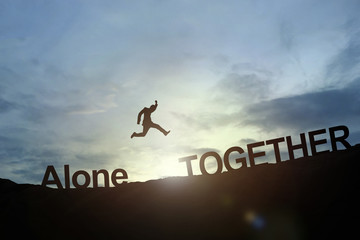 Silhouette of businessman glowing jump alone to together. succes