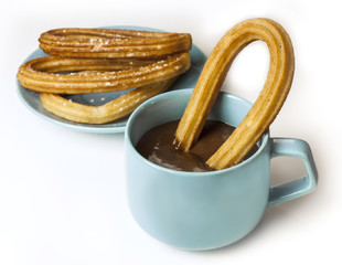 Traditional Spanish dessert, churros with hot chocolate, on whit