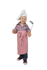 Little boy in cook chef hat and big spoon in hand shows thumb up - full height portrait isolated on white background - cuisine