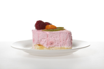 Sweet dessert portion - Delicious pink cake with fruits and berries on saucer on the table with white background - For menu or party invitation card