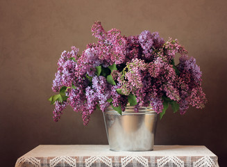 Still-life with a bouquet of lilacs.