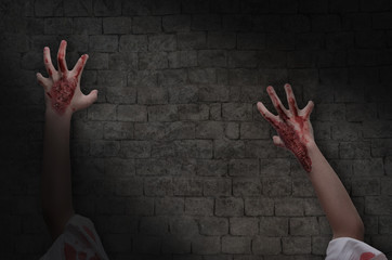 zombie hands climbing on the wall