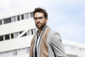 Businessman in scarf and spectacles