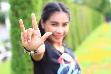 women with hand symbol i love you