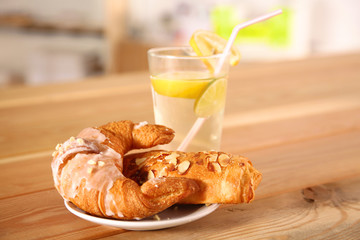 Croissant in the plate on the table