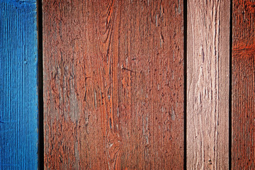 Old flaking multi colored painted wooden background