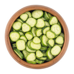  Fresh slice cucumber in wood bowl on white background