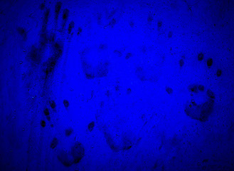Hand prints on blue wall