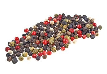 Heap of various pepper peppercorns seeds mix on white background