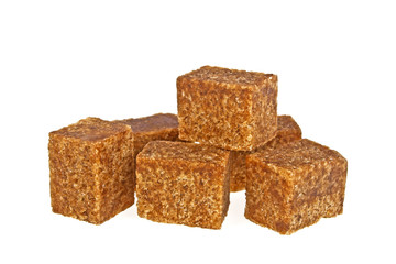 Brown sugar cubes isolated on a white background