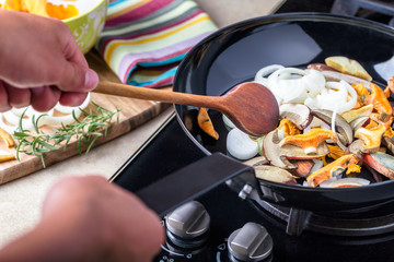 Frying pan with boletus, chanterelle and onion