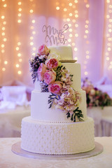 beautiful wedding cake with mr & mrs sign