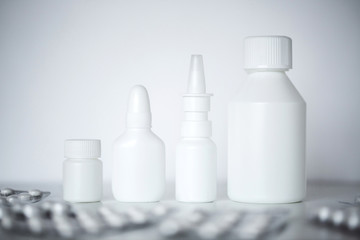 Collection of different medical white medicine bottles.