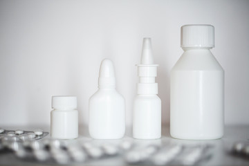 Collection of different medical white medicine bottles.