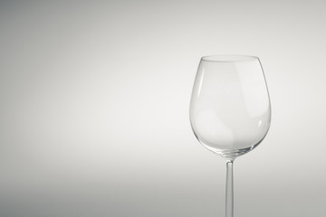Empty long stemmed stylish wineglass