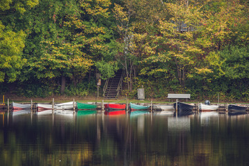 Colorful boats on row at an idyllic river