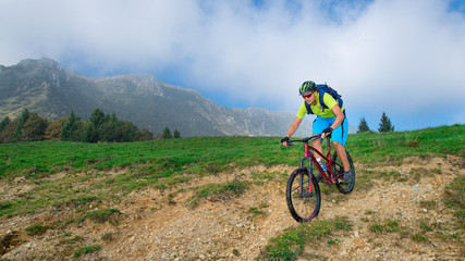 Fototapeta na wymiar A young male riding a mountain bike outdoor