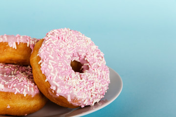 Iced doughnut on a light blue background