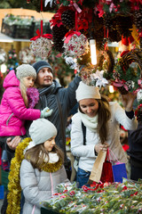 Happy family choosing decorations