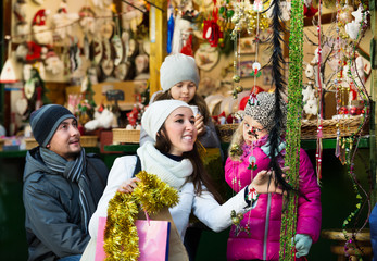 Family purchasing Christmas decoration and souvenirs