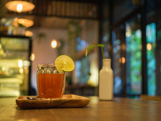 Honey leman tea on wooden table.