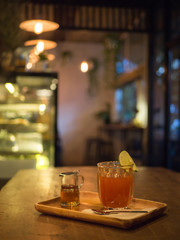 Honey leman tea on wooden table.