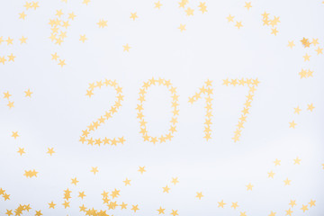 2017 year golden stars on a white background