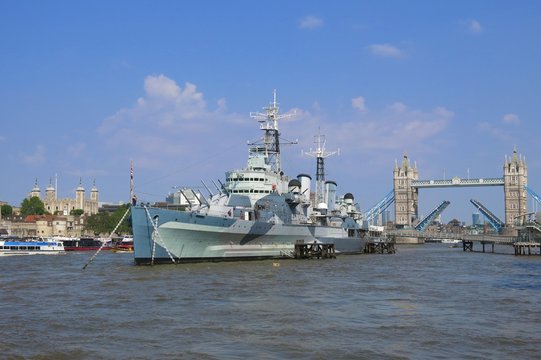 Thames River, London with HMS Belfast, Tower Bridge drawbridge and Tower of London by day