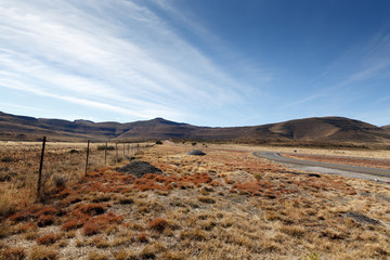 Mountains, road and fence pointing to the beautiful sky - Graaff