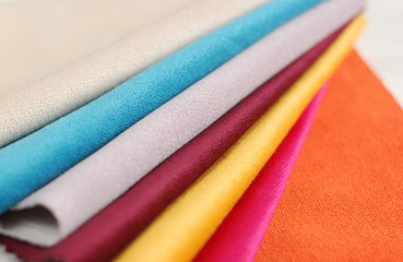 Bright collection of colorful velour textile samples. Fabric texture background