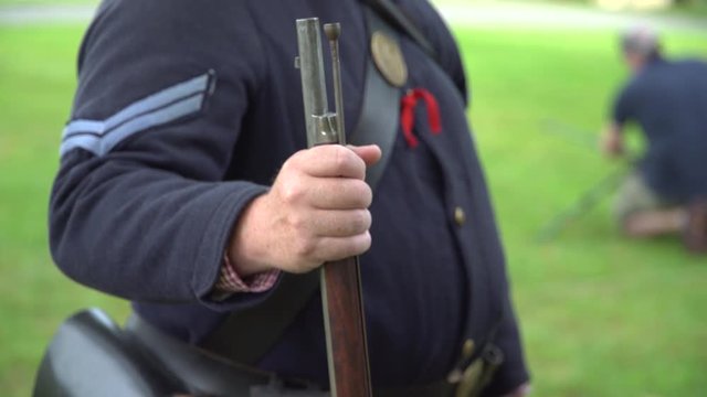 Civil War soldier holding his rifle