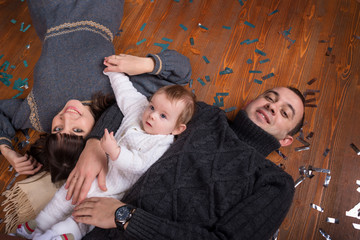Obraz premium family lay on wooden floor