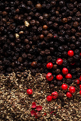 whole, crashed and ground black and red peppercorns