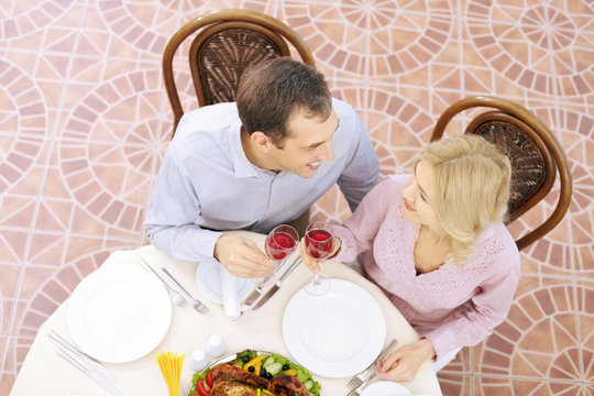 High angle view of husband and wife dining in restaurant