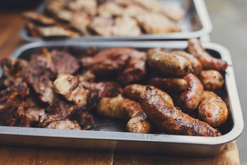 Street fast food, grilled sausages in container
