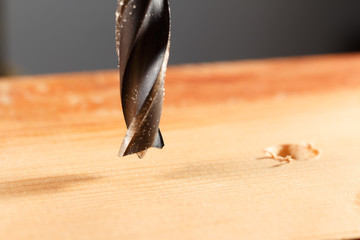 Spiral Drill on wooden plank, extrem closeup, low focus