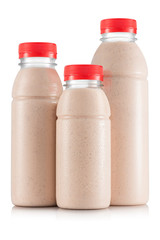 Pineapple and banana smoothie in three size of bottle - obrazy, fototapety, plakaty