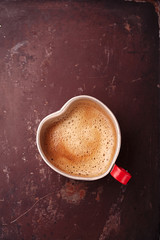 coffee in unusual vintage tin mug with glass heart