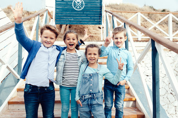 Obraz premium Fashion children on the sea shore