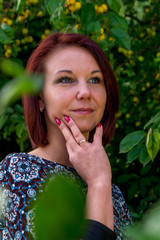 Fashion portrait of young sensual woman in garden